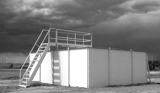 mobileshoothouseblackandwhite ATS Targets (Advanced Training Systems) Modular MOBILE Shoothouse set up on level ground at a military tactical training facility black and white